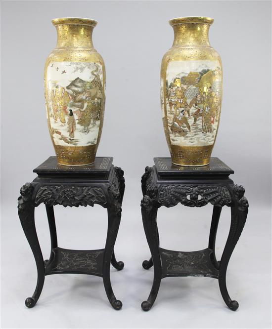 A pair of massive Japanese Satsuma pottery ovoid vases, late 19th century, total height on stands 150cm